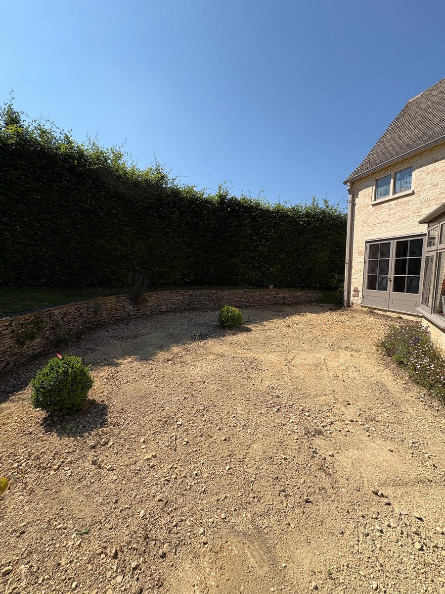 Before: a bare sub-base driveway in front of a Cotswold stone house