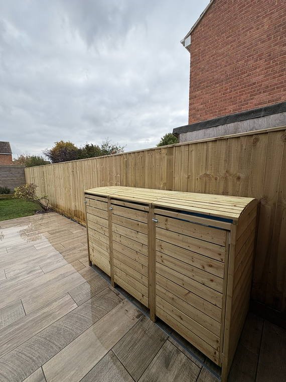 A slatted timber store built to sit flush against new decking